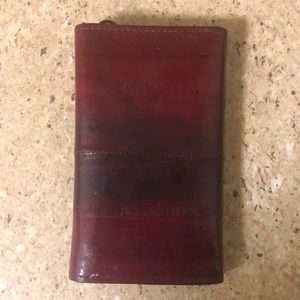 Vintage eel skin coin wallet with little hooks.